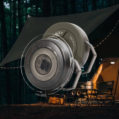 Campify String fairy light reel held in hand at night, showing warm amber LED string lights extended across dark outdoor ground, compact hub glowing with blue charge indicator, IP67 waterproof camping and home fairy lights.